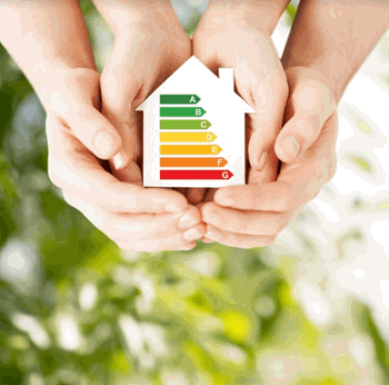 Two hands are holding a cut-out of a house with an energy efficiency rating shown from A (best) to G (worst).