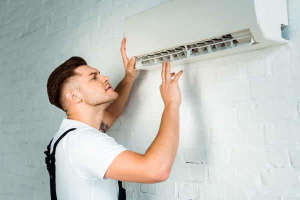 AC technician checking the AC