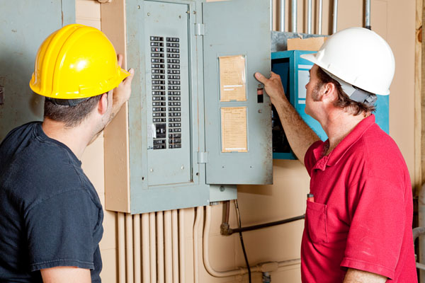 hvac-technicians-updating-circuit-breaker-for-ductless-install