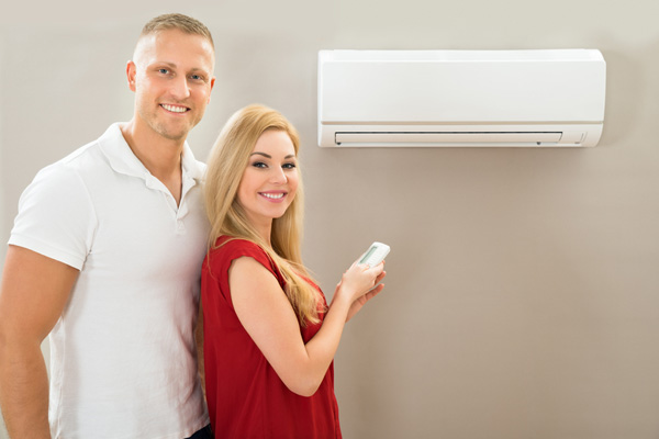 a couple with a ductless heat pump