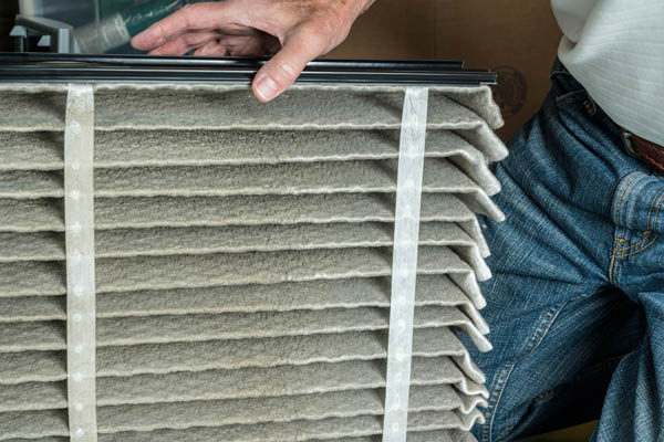 image of an oil-fired furnace filter replacement