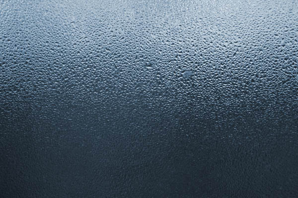 A close-up photo of a window with condensation.