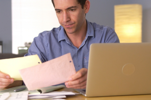 man assessing home propane use at home