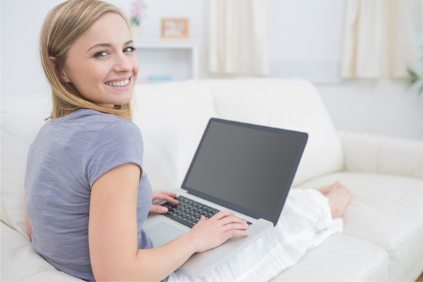 woman on computer looking at hvac contractor reviews