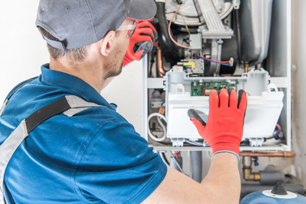 image of an hvac contractor performing a furnace installation