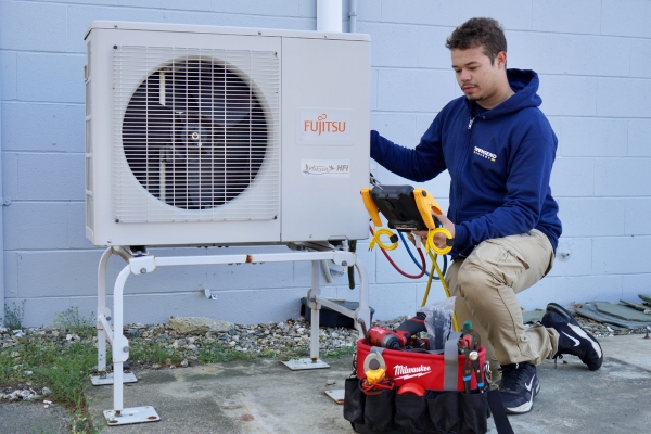 Townsend Energy HVAC technician attending to ductless outside unit