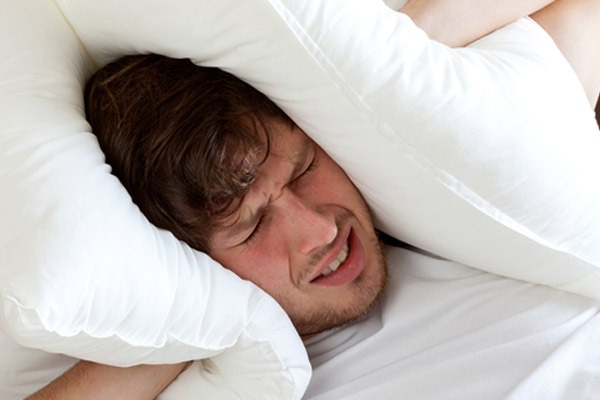 homeowner who can't sleep due to loud window air conditioner