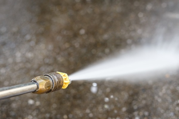 image of a power washer depicting never power wash your air conditioner