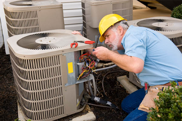 image of an hvac contractor performing air conditioner tune-up