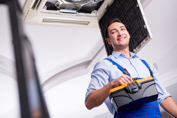 image of hvac contractor repairing hvac ductwork leak