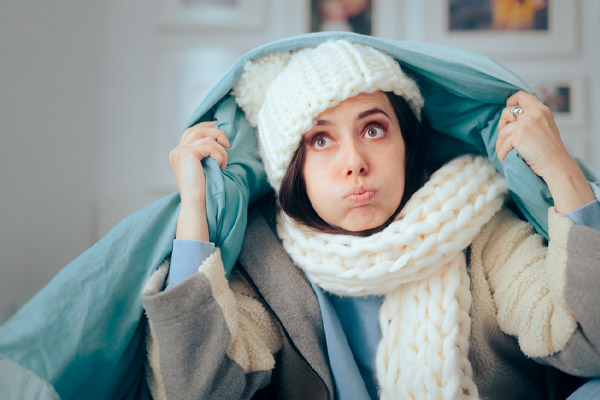 unhappy homeowner who feels chiily due to leaky hvac ductwork