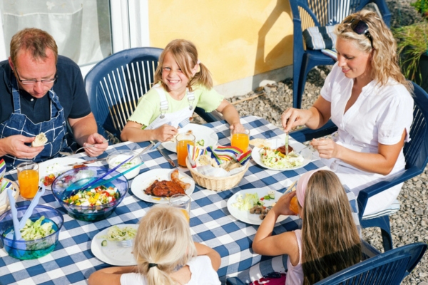 family dining al fresco to keep cool naturally in summer