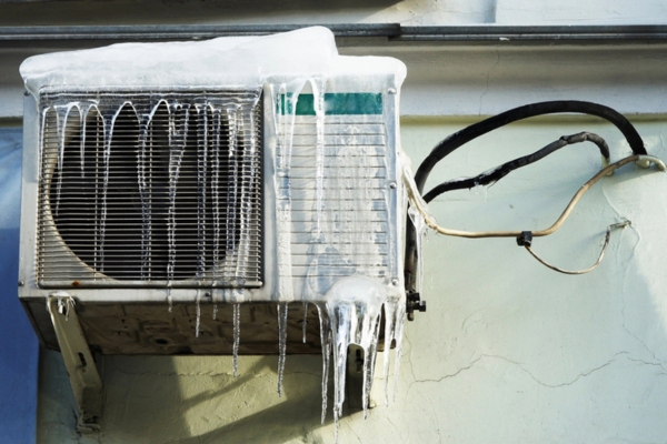 frozen ductless air conditioner outdoor unit in the summer