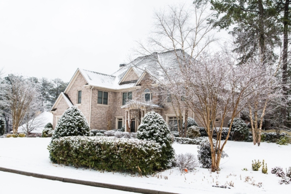 brick house after a heavy snow