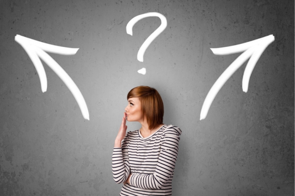 woman looking sideways while making a decision depicting choosing a fuel oil supplier