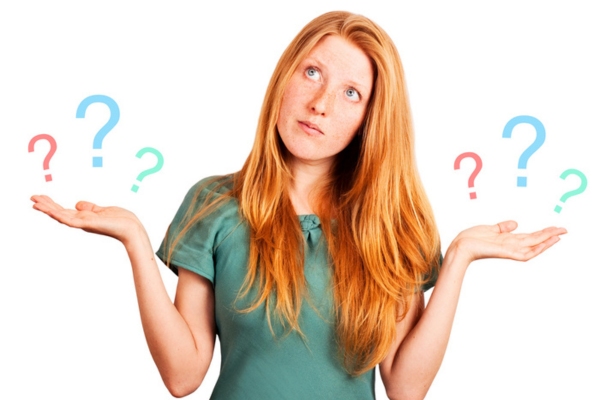 woman with both hands up showing question marks depicting FAQs about heating system repairs