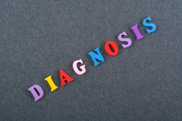 diagnosis spelled using letter magnets depicting diagnosing furnace issues correctly