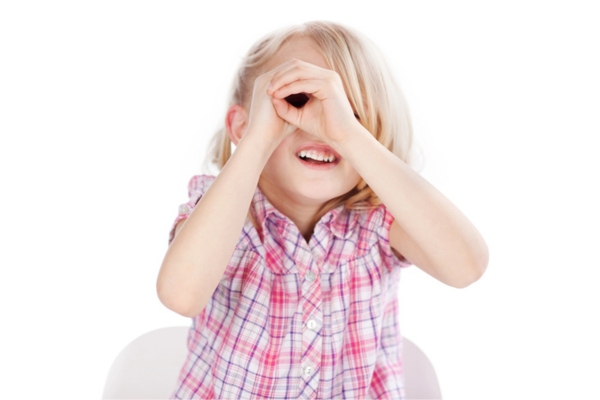 girl looking through hand telescope depicting visible ductwork damage