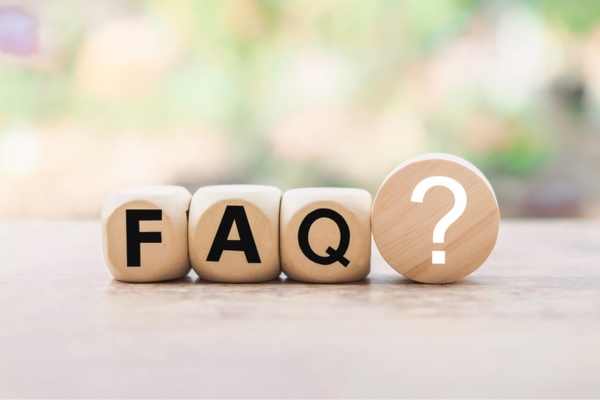 FAQ spelled using wooden letter cubes depicting questions about supplemental ductless heating