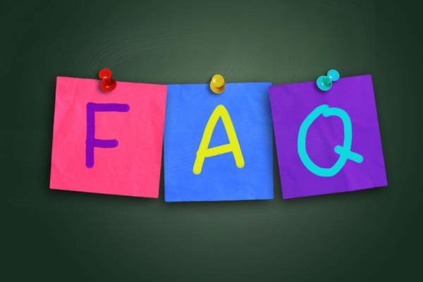 FAQ written on colored paper and pinned on a board depicting questions about IAQ improvement