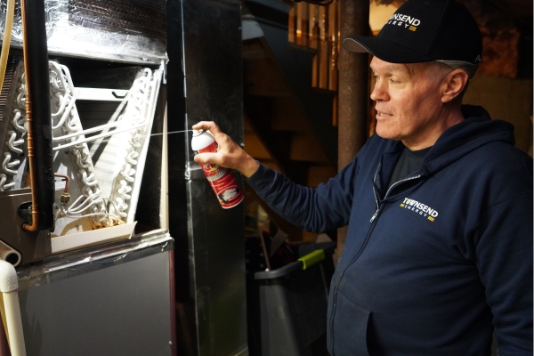 Townsend Energy professional HVAC technician servicing a furnace